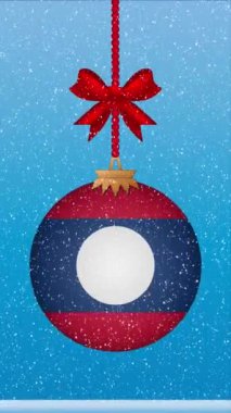 Laos bayrağıyla Noel balosuna kar yağıyor.