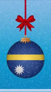 Nauru bayrağıyla Noel balosunun üstüne kar yağıyor.