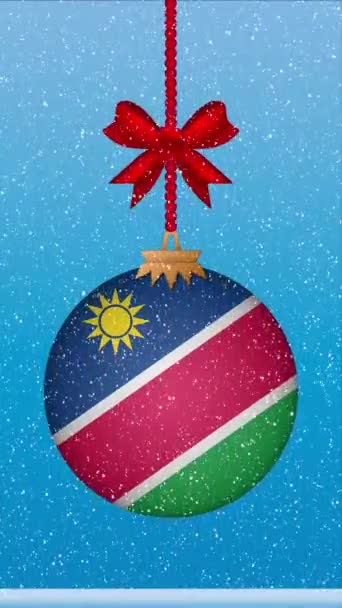 Снег Падает Рождественский Бал Флагом Намибии — стоковое видео