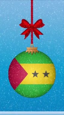 Kar, Sao Tome bayrağıyla Noel balosunun üzerine düşüyor.
