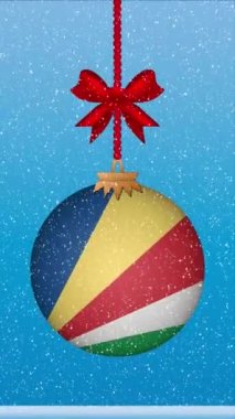 Seyşeller bayrağıyla Noel balosuna kar yağıyor.