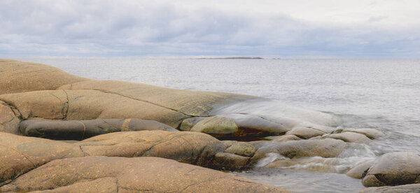 Rocky coast at sea archipelago in golf bothnianbay. High coast in the north of Sweden.