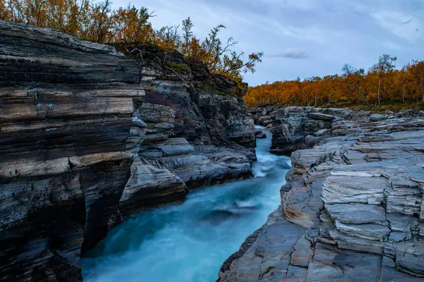 stock image Sunrise morning in a beautiful river landscape area in Abisko national park in north of Sweden