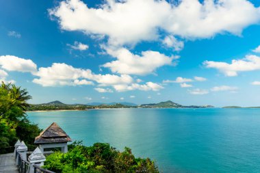 Beautiful view from the hill to Koh Samui. Triangular roof, turquoise sea and green mountains