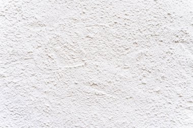 Kaba tahıl desenli beyaz desenli alçı duvar yüzeyi.