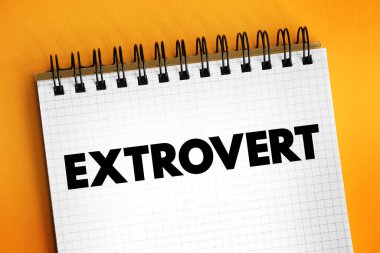 Extrovert are those who enjoy being around other people, text concept on notepad clipart