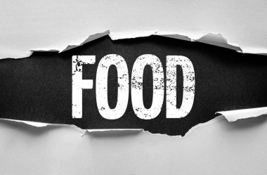 Yırtık kağıt aşağıdaki cesur grunge kelime FOOD, sembolize yemek, beslenme, yemek, ya da aşçılık teması güçlü sıkıntılı tipografi ve doku ile bir yüzey kırma
