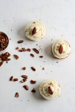 high angle view butter pecan cupcakes with nuts