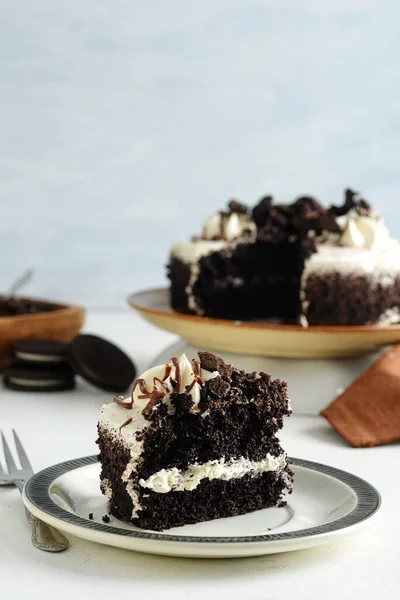 slice of cookies and cream cake with caramel sauce