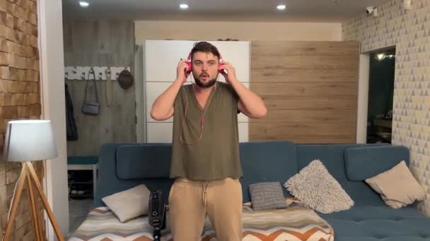 Crazy Young Man Enjoying Music Headphones Dancing Having Fun Home — Stock Video