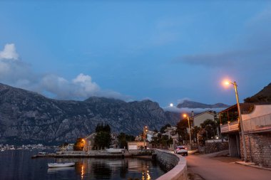 Beautiful cityscape of Kontorska Bay at night Montenegro.  clipart