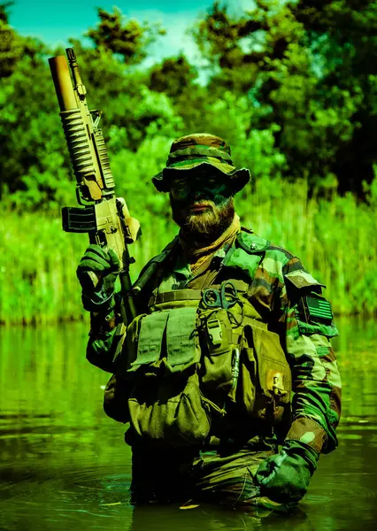 Focused Soldier Standing Marshland His Rifle Submerging Himself His Arms Stock Picture