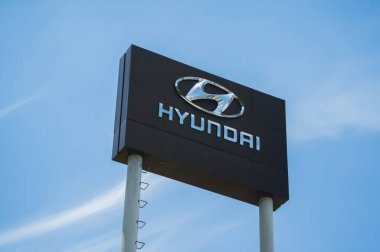 PHUKET, THAILAND - AUGUST 09, 2022: Signboard with logo of Hyundai Corporation against blue sky.