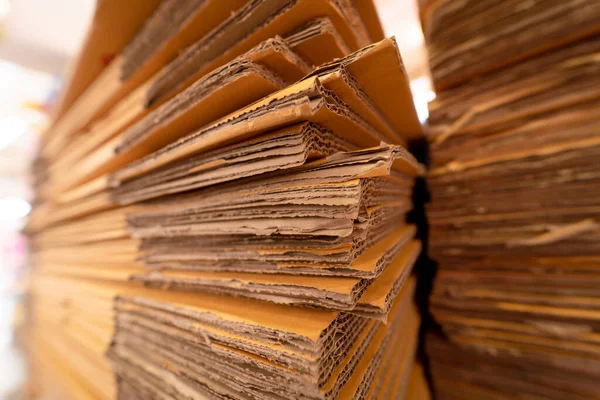 A stack of craft paper folded in a warehouse.