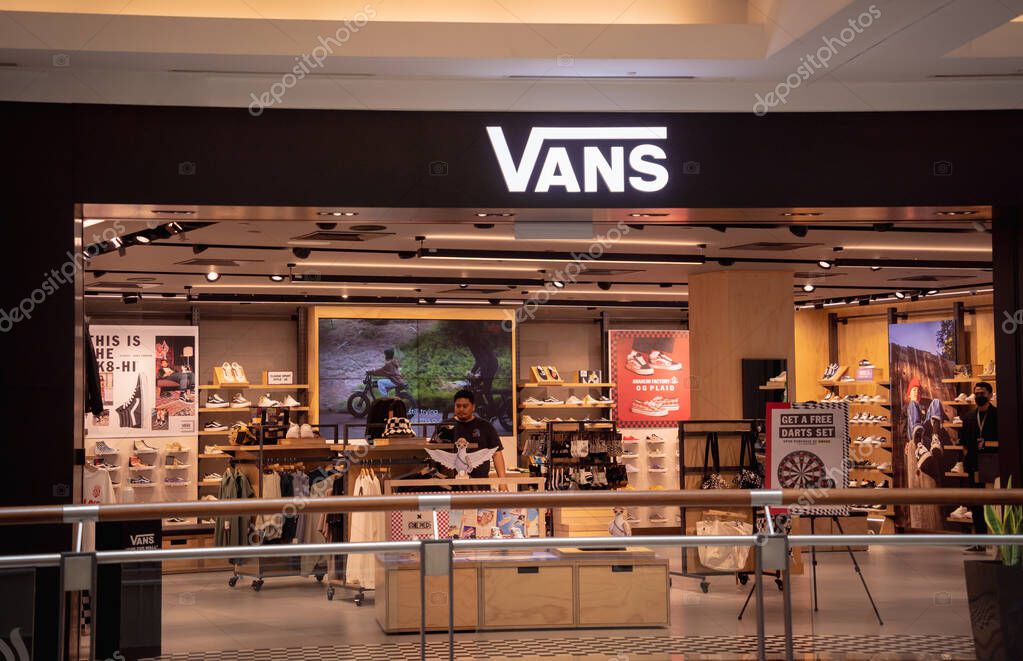 KUALA LUMPUR, MALAYSIA - DECEMBER 04, 2022: Vans brand retail shop logo signboard on the storefront in the shopping mall.