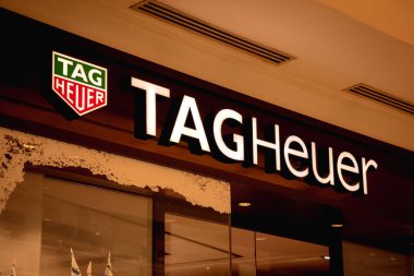 KUALA LUMPUR, MALAYSIA - DECEMBER 04, 2022: Tag Heuer brand retail shop logo signboard on the storefront in the shopping mall.