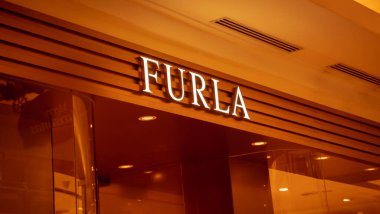 KUALA LUMPUR, MALAYSIA - DECEMBER 04, 2022: Furla brand retail shop logo signboard on the storefront in the shopping mall.