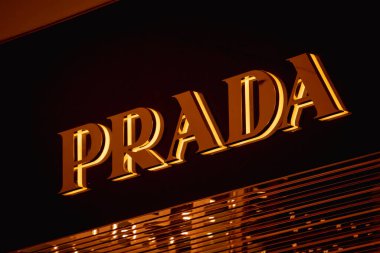 KUALA LUMPUR, MALAYSIA - DECEMBER 04, 2022: Prada brand retail shop logo signboard on the storefront in the shopping mall.