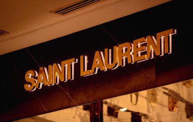 KUALA LUMPUR, MALAYSIA - DECEMBER 04, 2022: Saint Laurent brand retail shop logo signboard on the storefront in the shopping mall.