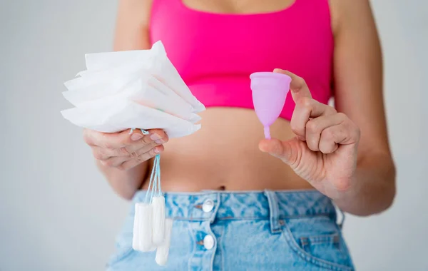 Young Woman Holding Menstrual Cup Tampons Sanitary Pads Her Hands — Stockfoto