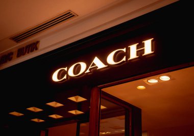 KUALA LUMPUR, MALAYSIA - DECEMBER 04, 2022: Coach brand retail shop logo signboard on the storefront in the shopping mall.