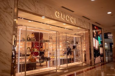 KUALA LUMPUR, MALAYSIA - DECEMBER 04, 2022: Gucci brand retail shop logo signboard on the storefront in the shopping mall