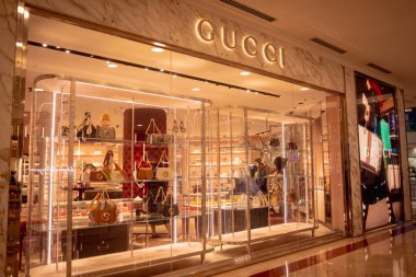 KUALA LUMPUR, MALAYSIA - DECEMBER 04, 2022: Gucci brand retail shop logo signboard on the storefront in the shopping mall