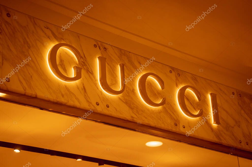 KUALA LUMPUR, MALAYSIA - DECEMBER 04, 2022: Gucci brand retail shop logo signboard on the storefront in the shopping mall