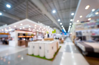 Blurred background of large household appliances and furniture store.