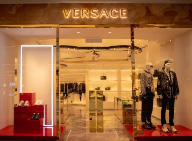 KUALA LUMPUR, MALAYSIA - DECEMBER 04, 2022: Versace brand retail shop logo signboard on the storefront in the shopping mall.