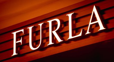KUALA LUMPUR, MALAYSIA - DECEMBER 04, 2022: Furla brand retail shop logo signboard on the storefront in the shopping mall.