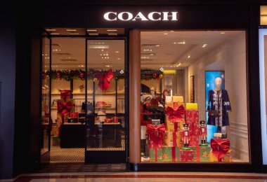 KUALA LUMPUR, MALAYSIA - DECEMBER 04, 2022: Coach brand retail shop logo signboard on the storefront in the shopping mall.