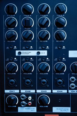 Rear view of speaker amplifier and equalizer at music studio.