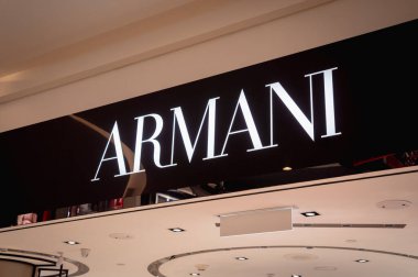 KUALA LUMPUR, MALAYSIA - DECEMBER 04, 2022: Armani brand retail shop logo signboard on the storefront in the shopping mall.