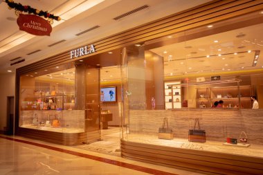 KUALA LUMPUR, MALAYSIA - DECEMBER 04, 2022: Furla brand retail shop logo signboard on the storefront in the shopping mall.