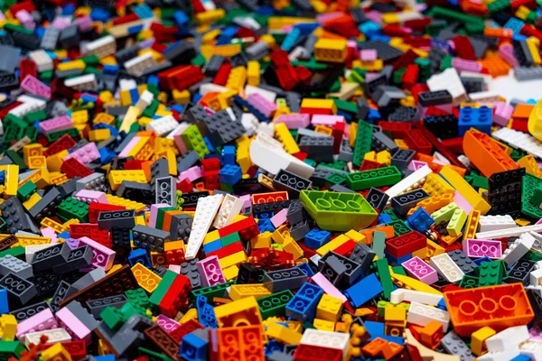 stock image View on multi color plastic bricks at the table