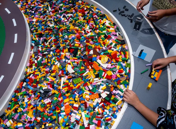 stock image View on multi color plastic bricks at the table