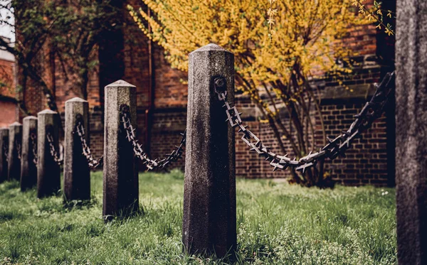 Old Stone Posts Chains Background Green Grass — Stock Photo, Image