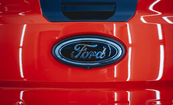 BANGKOK, THAILAND - SEPTEMBER 15, 2023: Ford logo on the red car.