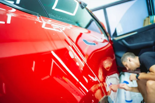 Process Installing Protective Film New Red Car — Stock Photo, Image