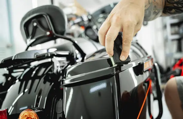 The process of nano coating motorcycle applying soft fiber sponge.