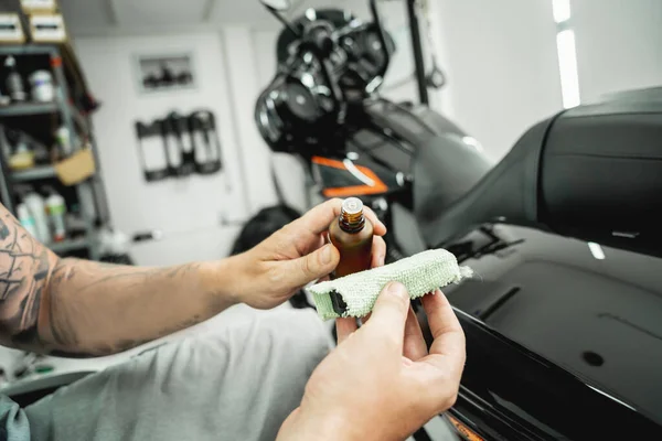 The process of nano coating motorcycle applying soft fiber sponge.