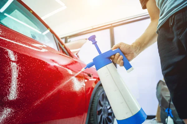Worker Car Service Sprays Water Car Applying Protective Film — Stock Photo, Image