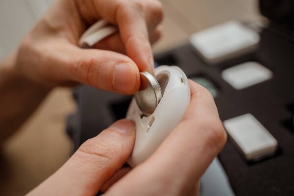 A technician works with a demo kit of the smart home system.
