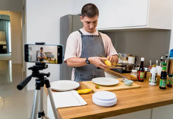 stock image The chef is broadcasting live from workshop how to prepare a vegetarian food.