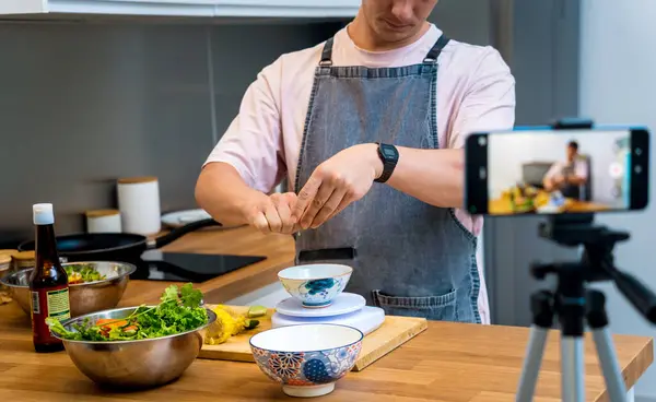 stock image The chef is broadcasting live from workshop how to prepare a spicy glass noodle salad.