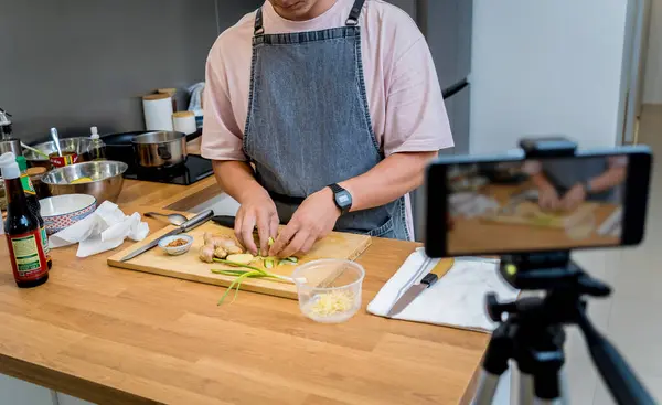 stock image The chef is broadcasting live from workshop how to prepare a vegetarian food.