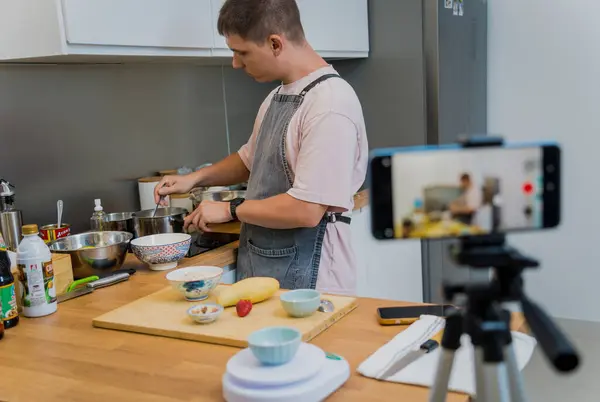 stock image The chef is broadcasting live from workshop how to prepare a vegetarian food.