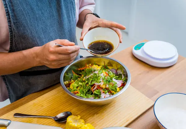 stock image Chef at the kitchen preparing spicy glass noodle salad.