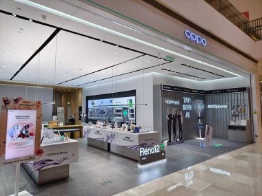 KUALA LUMPUR, MALAYSIA - AUGUST 28, 2024: OPPO brand retail shop in the large shopping mall. clipart